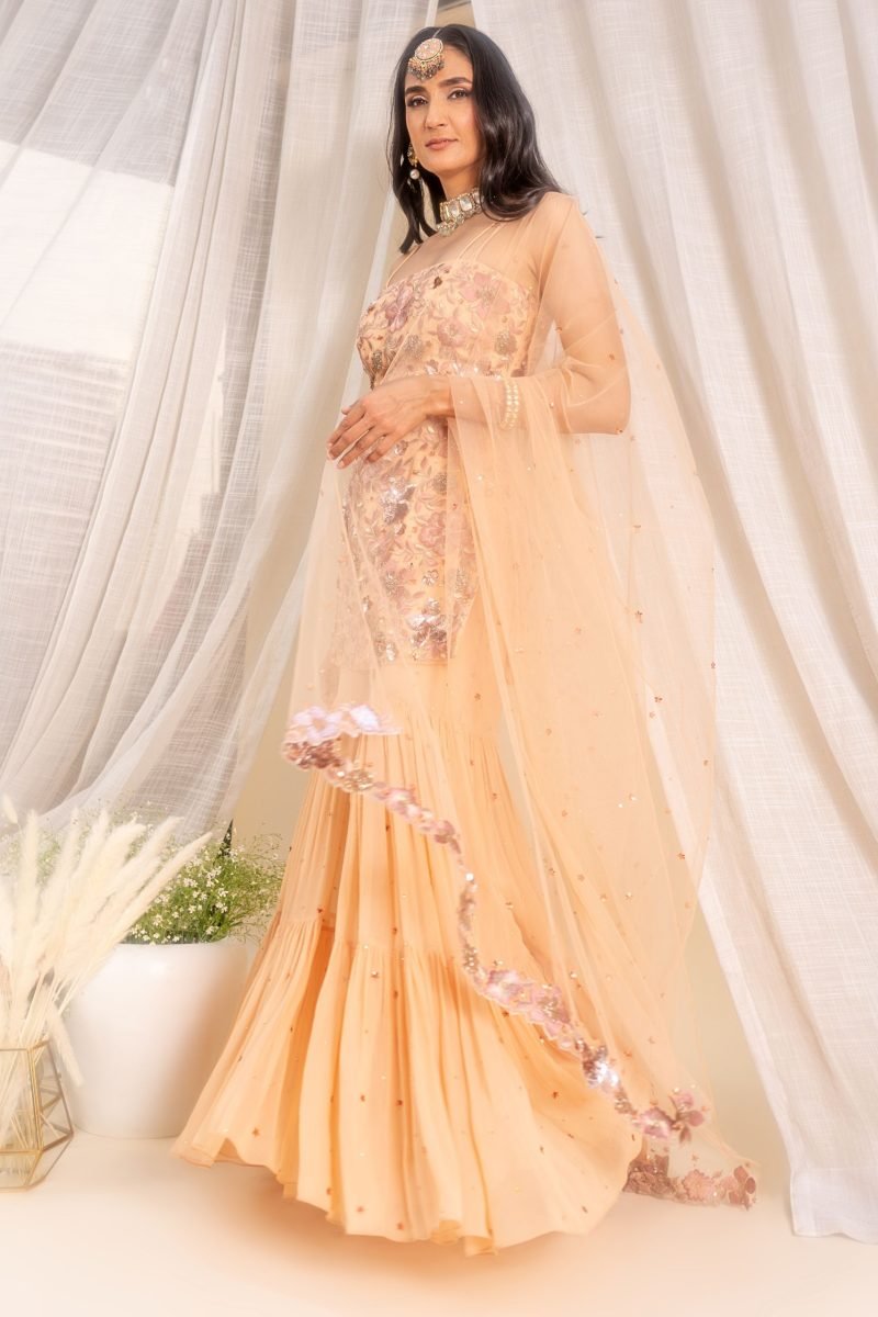 Tiered Beige Color Sharara With Floral Kurti And Dupatta