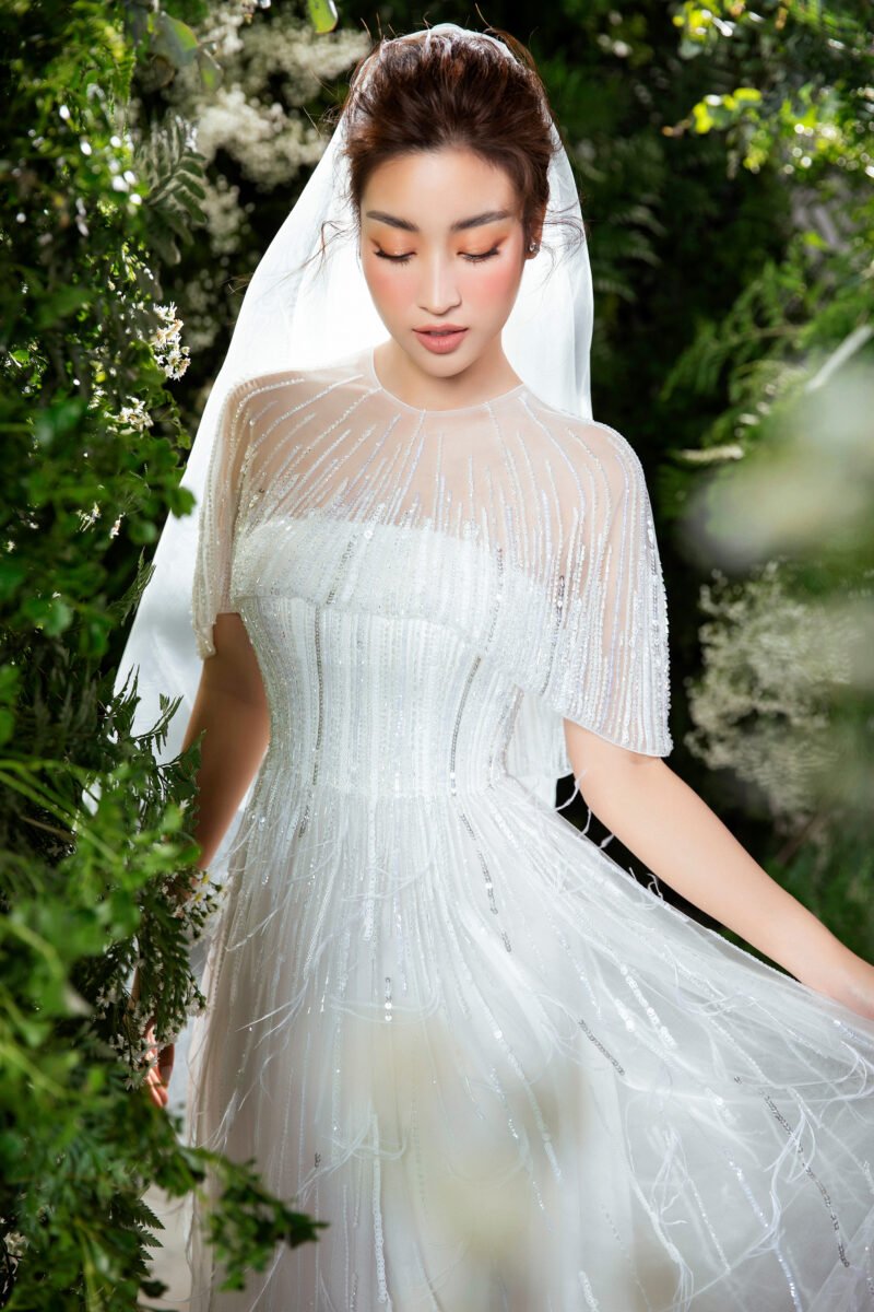 Hand-Embellished Crystal White Bridal Gown with Feather Accents - Image 7